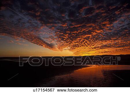 Stock Photo -  sunset, sunrise, Cumberland Island, Georgia, Beautiful sunset on Cumberland Island National Seashore along the Atlantic Ocean in Georgia.. Fotosearch