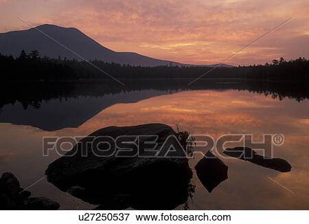 sunset, sunrise lake, Maine, Baxter State Park, Scenic sunset with the reflection of Mt. Katahdin in the calm waters of Daicey Pond in Baxter State Park. View Large Photo Image Stock Photo - sunset, sunrise lake, Maine, Baxter State Park, Scenic sunset with the reflection of Mt. Katahdin in the calm waters of Daicey Pond in Baxter State Park. . Fotosearch