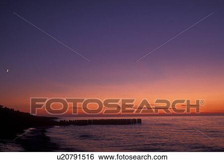 sunset, sunrise, Lake Superior, Upper Peninsula, U. P Michigan, Scenic view of the sunset over the calm waters of Lake Superior at Whitefish Point in the state of Michigan. View Large Photo Image Stock Photograph - sunset, sunrise, Lake Superior, Upper Peninsula, U. P Michigan, Scenic view of the sunset over the calm waters of Lake Superior at Whitefish Point in the state of Michigan.. Fotosearch