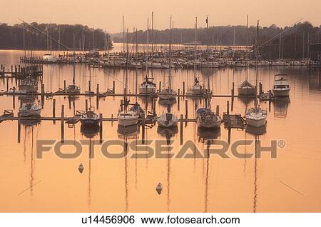 sunset, sunrise, marina, Georgetown, Maryland, Sunset over the marina on Sassatras River in Chesapeake Bay in Georgetown in Maryland. View Large Photo Image Stock Photograph - sunset, sunrise, marina, Georgetown, Maryland, Sunset over the marina on Sassatras River in Chesapeake Bay in Georgetown in Maryland.. Fotosearch