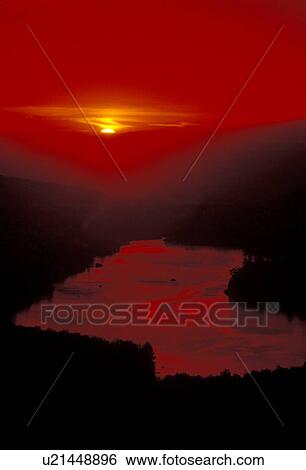 Stock Photograph -  sunset, sunrise, Vermont, lake, Groton State Forest, Scenic view of Kettle Pond against a red sky at sunset from Owl's Head Overlook in Groton State Forest.. Fotosearch