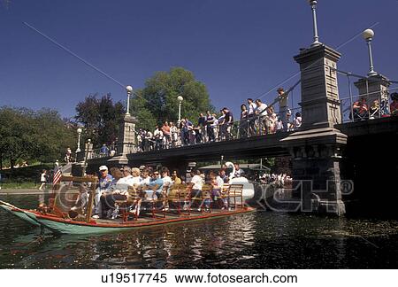 swan boat, Boston, Boston Public Garden, swan paddleboat, Massachusetts, Swan boat carrying passengers on the pond on a sunny day in Boston Public Garden in Boston in the state of Massachusetts. People watching from a bridge above. View Large Photo Image Stock Photography - swan boat, Boston, Boston Public Garden, swan paddleboat, Massachusetts, Swan boat carrying passengers on the pond on a sunny day in Boston Public Garden in Boston in the state of Massachusetts. People watching from a bridge above. . Fotosearch