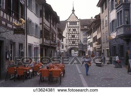 Switzerland, Stein, Europe, Outdoor cafe in Market Square in the picturesque village of Stein am Rhein with its half-timbered houses in the Canton of Schaffhausen. View Large Photo Image Stock Image - Switzerland, Stein, Europe, Outdoor cafe in Market Square in the picturesque village of Stein am Rhein with its half-timbered houses in the Canton of Schaffhausen.. Fotosearch