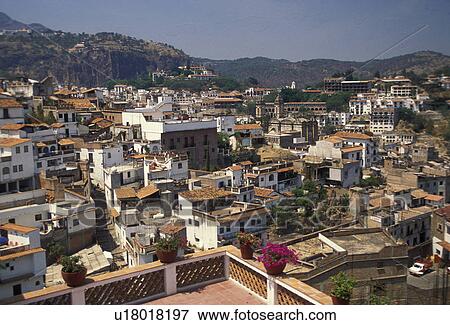 Taxco, Mexico, Aerial view of the old mining town of Taxco Silver City in the state of Guerrero. Taxco is the oldest mining town in North America View Large Photo Image Stock Photo - Taxco, Mexico, Aerial view of the old mining town of Taxco Silver City in the state of Guerrero. Taxco is the oldest mining town in North America . Fotosearch
