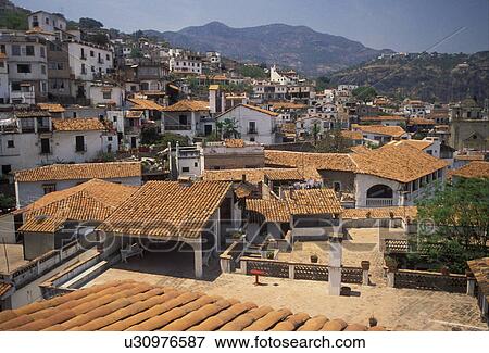 Taxco, Mexico, Aerial view of the old mining town of Taxco Silver City in the state of Guerrero. Taxco is the oldest mining town in North America View Large Photo Image Stock Photo - Taxco, Mexico, Aerial view of the old mining town of Taxco Silver City in the state of Guerrero. Taxco is the oldest mining town in North America . Fotosearch