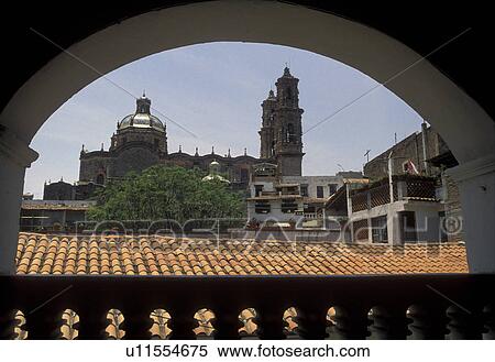 Taxco, Mexico, View of the old mining town of Taxco Silver City through the archway of a building in the state of Guerrero. Taxco is the oldest mining town in North America View Large Photo Image Stock Photography - Taxco, Mexico, View of the old mining town of Taxco Silver City through the archway of a building in the state of Guerrero. Taxco is the oldest mining town in North America . Fotosearch