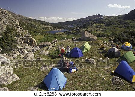 Stock Image -  tent, Bighorn Mountains, Bighorn National Forest, camping, backpacking, Wyoming, Tents set up to camp for the night next to Lake Mistymoon in the Cloud Peak Wilderness Area in Bighorn National Forest in the state of Wyoming. . Fotosearch