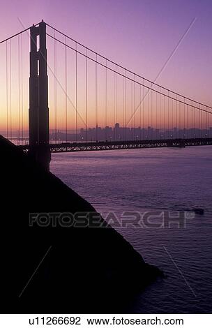 Stock Image -  The Golden Gate Bridge, San Francisco, San Francisco Bay, Pacific Ocean, California, The Golden Gate Bridge of San Francisco at sunrise, the longest single-span suspension bridges ever built, in the state of California.. Fotosearch