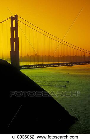 The Golden Gate Bridge, San Francisco, bridge, San Francisco Bay, Pacific Ocean, California, The Golden Gate Bridge of San Francisco at sunrise, the longest single-span suspension bridges ever built, in the state of California. (orange/green filter) View Large Photo Image Stock Image - The Golden Gate Bridge, San Francisco, bridge, San Francisco Bay, Pacific Ocean, California, The Golden Gate Bridge of San Francisco at sunrise, the longest single-span suspension bridges ever built, in the state of California. (orange/green filter) . Fotosearch
