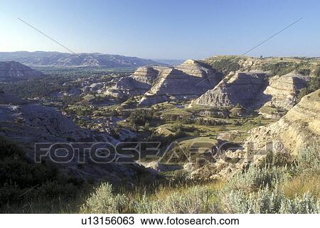 Theodore Roosevelt National Park, North Dakota, A scenic view of rock formations (badlands) at Theodore Roosevelt National Park, North Unit. View Large Photo Image Stock Image - Theodore Roosevelt National Park, North Dakota, A scenic view of rock formations (badlands) at Theodore Roosevelt National Park, North Unit.. Fotosearch