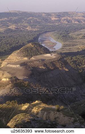 Theodore Roosevelt National Park, North Dakota, A view of rock formations (badlands) and The Little Missouri River at Theodore Roosevelt National Park, North Unit. View Large Photo Image Stock Image - Theodore Roosevelt National Park, North Dakota, A view of rock formations (badlands) and The Little Missouri River at Theodore Roosevelt National Park, North Unit.. Fotosearch