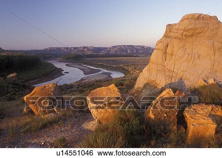 Theodore Roosevelt National Park, North Dakota, The early morning sun shines on the rock formation at Theodore Roosevelt National Park, North Unit, overlooking the Little Missouri River. View Large Photo Image Stock Photograph - Theodore Roosevelt National Park, North Dakota, The early morning sun shines on the rock formation at Theodore Roosevelt National Park, North Unit, overlooking the Little Missouri River.. Fotosearch