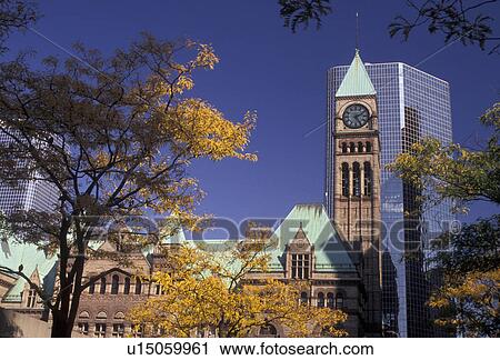 Stock Image -  Toronto, Canada, Ontario, A modern high-rise building stands behind the Old City Hall in downtown Toronto.. Fotosearch