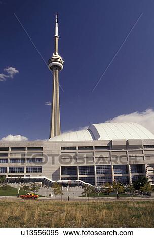 Stock Photography -  Toronto, Canada, Ontario, Skydome (home of baseball's Toronto Blue Jays and CFL'sArgonauts) and CN Tower (1815 ft. ) in downtown Toronto.. Fotosearch