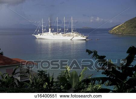 Stock Image -  Tortola, British Virgin Islands, cruise, Caribbean, Virgin Islands, BVI, B. V. I Scenic view of a Club Med Cruise Ship in White Bay in Jost Van Dyke on the island of Tortola on the British Virgin Islands.. Fotosearch