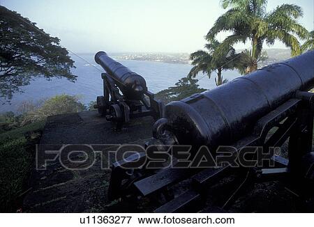 Trinidad and Tobago, cannon, fort, Caribbean, Scarborough, Caribbean Islands, Cannons from the ruins of Old Fort King George overlook Scarborough Harbor on the island of Tobago (a British Commonwealth member). View Large Photo Image Stock Photo - Trinidad and Tobago, cannon, fort, Caribbean, Scarborough, Caribbean Islands, Cannons from the ruins of Old Fort King George overlook Scarborough Harbor on the island of Tobago (a British Commonwealth member).. Fotosearch