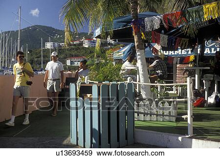 U. S. Virgin Islands, St. Thomas, Caribbean, USVI, U. S. V. I Virgin Islands, Tourists walking outside the Ramada Yacht Haven in Charlotte Amalie the territorial capital of the US Virgin Islands on Saint Thomas Island. View Large Photo Image Stock Photo - U. S. Virgin Islands, St. Thomas, Caribbean, USVI, U. S. V. I Virgin Islands, Tourists walking outside the Ramada Yacht Haven in Charlotte Amalie the territorial capital of the US Virgin Islands on Saint Thomas Island. . Fotosearch
