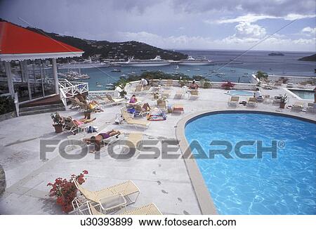 Stock Photo -  U. S. Virgin Islands, St. Thomas, Caribbean, Virgin Islands, pool, USVI, U. S. V. I Swimming pool at Bluebeard's Castle overlooks the scenic harbor in Charlotte Amalie the territorial capital of the US Virgin Islands on Saint Thomas Island. . Fotosearch