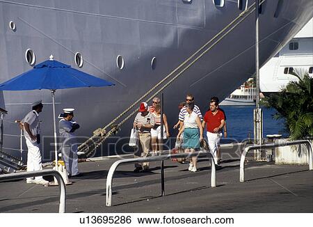 U. S. Virgin Islands, St. Thomas, cruise, Caribbean, U. S. V. I Virgin Islands, Tourists returning to cruise ship moored along Long Bat Dock in Charlotte Amalie the territorial capital of the US Virgin Islands on Saint Thomas Island. View Large Photo Image Stock Photograph - U. S. Virgin Islands, St. Thomas, cruise, Caribbean, U. S. V. I Virgin Islands, Tourists returning to cruise ship moored along Long Bat Dock in Charlotte Amalie the territorial capital of the US Virgin Islands on Saint Thomas Island. . Fotosearch