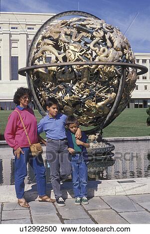 United Nations, Geneva, Switzerland, Europe, Mother and children pose for picture at a sculpture of the world in front of the European Headquarters of the United Nations (Palais des Nations) in Geneva. View Large Photo Image Stock Image - United Nations, Geneva, Switzerland, Europe, Mother and children pose for picture at a sculpture of the world in front of the European Headquarters of the United Nations (Palais des Nations) in Geneva.. Fotosearch