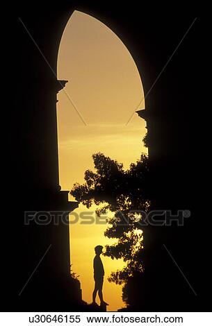 Valley Forge Park, arch, arc, Valley Forge, Pennsylvania, Silhouette of a woman under the National Memorial Arch at sunrise in Valley Forge National Historical Park in Valley Forge in the state of Pennsylvania. View Large Photo Image Stock Photography - Valley Forge Park, arch, arc, Valley Forge, Pennsylvania, Silhouette of a woman under the National Memorial Arch at sunrise in Valley Forge National Historical Park in Valley Forge in the state of Pennsylvania.. Fotosearch