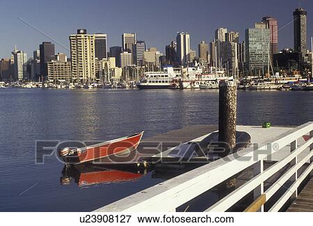 Vancouver, skyline, British Columbia, Canada, Skyline of Vancouver from across the water at Vancouver Rowing Club in the province of British Columbia. Red rowboat in foreground. View Large Photo Image Stock Photo - Vancouver, skyline, British Columbia, Canada, Skyline of Vancouver from across the water at Vancouver Rowing Club in the province of British Columbia. Red rowboat in foreground.. Fotosearch