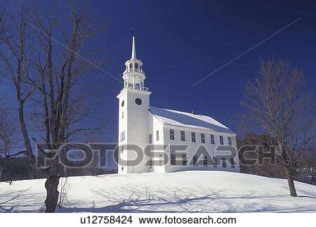 Picture -  Vermont, church, Strafford, VT, Strafford Town Hall ca. 1779, blue sky, daylight, snow, winter.. Fotosearch