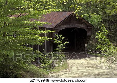 Stock Photo -  Vermont, covered bridge, Light green leaves of the trees in the spring surround Downers Covered Bridge, circa 1840, in Weathersfield.. Fotosearch