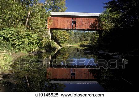 Vermont, covered bridge, Slaughter House Covered Bridge reflects in the calm waters of Dog River in Northfield View Large Photo Image Stock Photography - Vermont, covered bridge, Slaughter House Covered Bridge reflects in the calm waters of Dog River in Northfield . Fotosearch