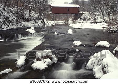 Vermont, covered bridge, The chilly Dog River flows swiftly downstream under the Slaughter House Covered Bridge in Northfield in winter., View Large Photo Image Stock Image - Vermont, covered bridge, The chilly Dog River flows swiftly downstream under the Slaughter House Covered Bridge in Northfield in winter., . Fotosearch