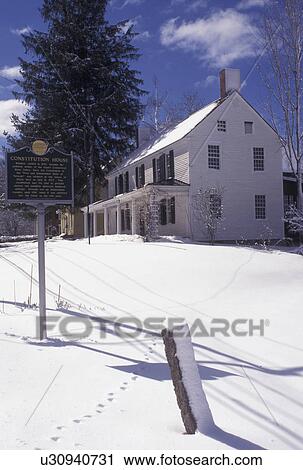 Stock Image -  Vermont, VT, Old Constitution House 1777, The Birthplace of Vermont, in the town of Windsor in the snow in winter.. Fotosearch