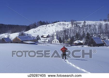 Vermont, VT, Photographer takes picture of the scenic village of East Corinth in a snow-covered field in the winter View Large Photo Image Stock Photography - Vermont, VT, Photographer takes picture of the scenic village of East Corinth in a snow-covered field in the winter . Fotosearch