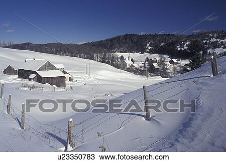 Stock Image -  Vermont, VT, Scenic snow-covered village of East Corinth from a farm in the winter . Fotosearch