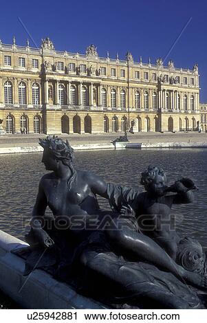 Stock Image -  Versailles, France, Yvelines, Paris, Europe, The Versailles Palace, Statues adorn the fountains on the grounds of The Versailles Palace. Chateau built in 1631 and home of 17th and 18th-century French kings.. Fotosearch