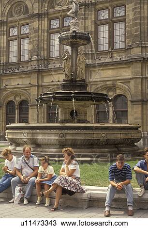 Vienna, Austria, Europe, People sitting at fountain in front of the State Opera House (Staatsoper) in Vienna. View Large Photo Image Stock Image - Vienna, Austria, Europe, People sitting at fountain in front of the State Opera House (Staatsoper) in Vienna.. Fotosearch