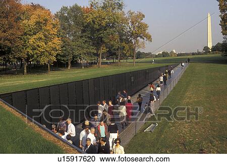 Vietnam Veterans Memorial Wall, Washington, D. C District of Columbia, People walk along the polished black granite wall of the Vietnam Veterans Memorial inscribed with the men and women who died serving in the U. S. Armed Forces during the Vietnam War in View Large Photo Image Stock Image - Vietnam Veterans Memorial Wall, Washington, D. C District of Columbia, People walk along the polished black granite wall of the Vietnam Veterans Memorial inscribed with the men and women who died serving in the U. S. Armed Forces during the Vietnam War in . Fotosearch