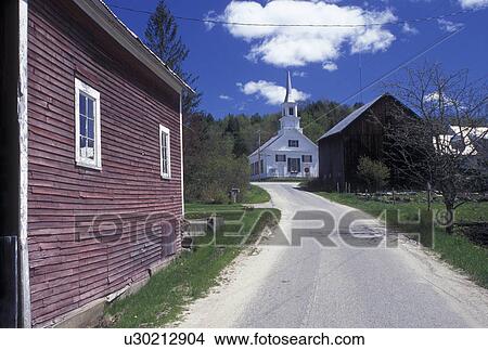 Picture -  village, Vermont, VT, A country road leads up to the scenic village of Waits River and the community church in the spring.. Fotosearch