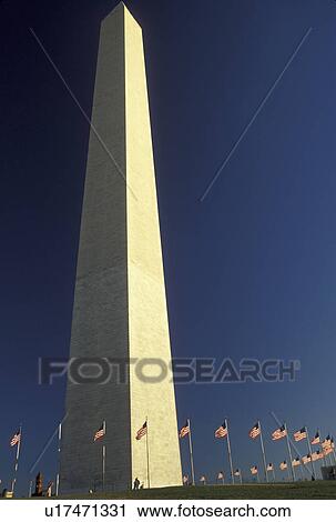 Washington Monument, Washington, DC, District of Columbia, The Washington Monument stands erect against the deep blue sky with the U. S. flags surrounding it in Washington, D. C. the Capital City of the United States. View Large Photo Image Stock Image - Washington Monument, Washington, DC, District of Columbia, The Washington Monument stands erect against the deep blue sky with the U. S. flags surrounding it in Washington, D. C. the Capital City of the United States.. Fotosearch