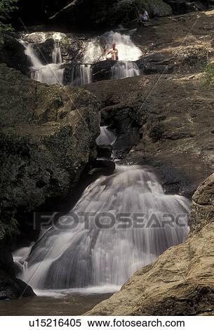 Stock Photography -  waterfall, Cunningham Falls State Park, Maryland, People sitting by the waterfall at Cunningham State Park in Cunningham Falls in the state of Maryland.. Fotosearch