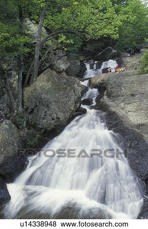 waterfall, Maryland, Cunningham Falls State Park, People relaxing next to the waterfall at Cunningham Falls State Park in the state of Maryland. View Large Photo Image Stock Photo - waterfall, Maryland, Cunningham Falls State Park, People relaxing next to the waterfall at Cunningham Falls State Park in the state of Maryland. . Fotosearch