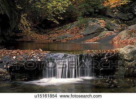 waterfall, river, Maine, A waterfall rushes over the rocks into a pool of water in White Mountain National Forest. View Large Photo Image Picture - waterfall, river, Maine, A waterfall rushes over the rocks into a pool of water in White Mountain National Forest.. Fotosearch