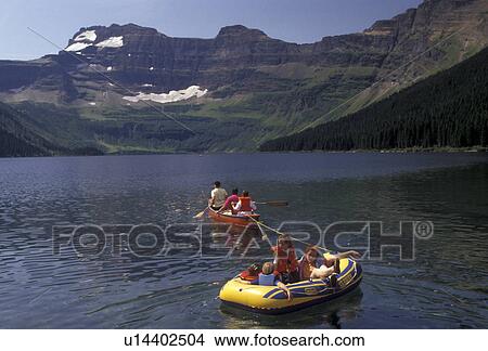 Waterton Lakes National Park, lake, canoe, raft, Alberta, Canada, Rocky Mountains, Waterton-Glacier International Peace Park, Three people in a canoe pull a rubber raft with children on Cameron Lake in Waterton Lakes National Park in the province of Albe View Large Photo Image Picture - Waterton Lakes National Park, lake, canoe, raft, Alberta, Canada, Rocky Mountains, Waterton-Glacier International Peace Park, Three people in a canoe pull a rubber raft with children on Cameron Lake in Waterton Lakes National Park in the province of Albe. Fotosearch