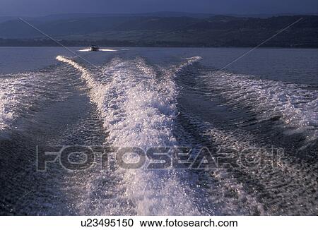Stock Image -  wave, water, boat wave, lake, Switzerland, Vaud, Europe, Boating on beautiful Lac Leman (Lake Geneva) in Nyon.. Fotosearch