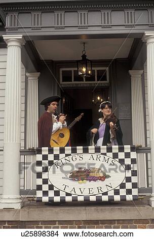 Williamsburg, Colonial Williamsburg Historic Area, Virginia, Costumed musicians play on the balcony of the King Arms Tavern in Colonial Williamsburg in the state of Virginia. View Large Photo Image Picture - Williamsburg, Colonial Williamsburg Historic Area, Virginia, Costumed musicians play on the balcony of the King Arms Tavern in Colonial Williamsburg in the state of Virginia.. Fotosearch