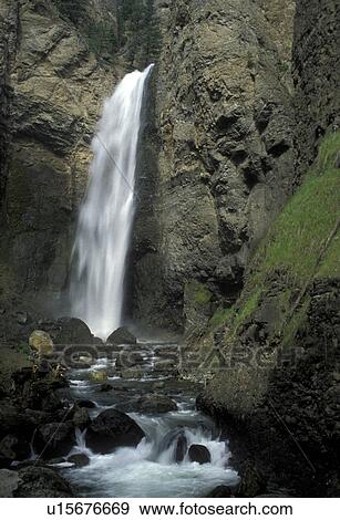 Yellowstone National Park, waterfall, Wyoming, Tower Falls cascade down to the river in Yellowstone National Park. View Large Photo Image Stock Photo - Yellowstone National Park, waterfall, Wyoming, Tower Falls cascade down to the river in Yellowstone National Park.. Fotosearch