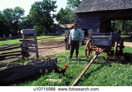 Stock Photo -  Abraham Lincoln, homestead, Lerna, IL, Illinois, Interpreter next to the Barn at Lincoln Log Cabin State Historic Site.. Fotosearch