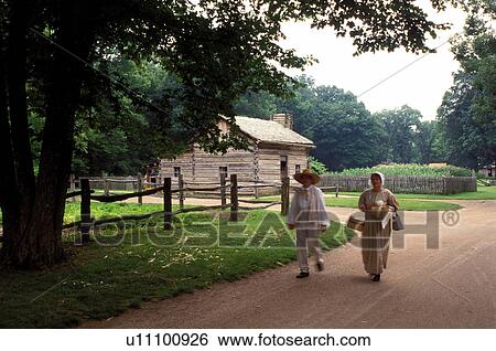 Stock Photograph -  Abraham Lincoln, Petersburg, IL, Illinois, Interpreters walking down country lane at Lincoln's New Salem State Historic Site.. Fotosearch
