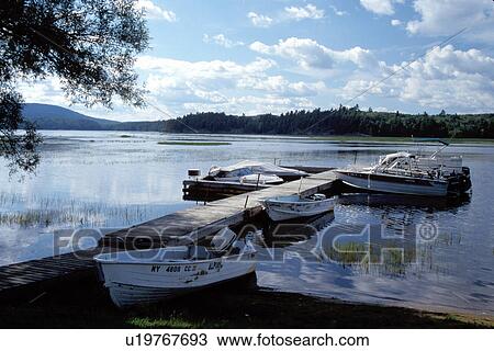 Adirondacks, New York, NY, Moody, Boats moored on a dock on Tupper Lake in Adirondack Park. View Large Photo Image Stock Image - Adirondacks, New York, NY, Moody, Boats moored on a dock on Tupper Lake in Adirondack Park.. Fotosearch