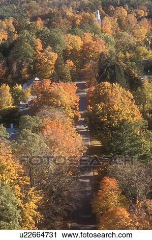 Stock Image -  aerial, fall, Bennington, VT, Vermont, An aerial view of the town of Bennington surrounded by colorful foliage in autumn from the Bennington Battle Monument.. Fotosearch