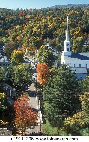 Stock Photograph -  aerial, village, fall, Stowe, VT, Vermont, Aerial view of the scenic village of Stowe surrounded by colorful fall foliage in autumn. . Fotosearch